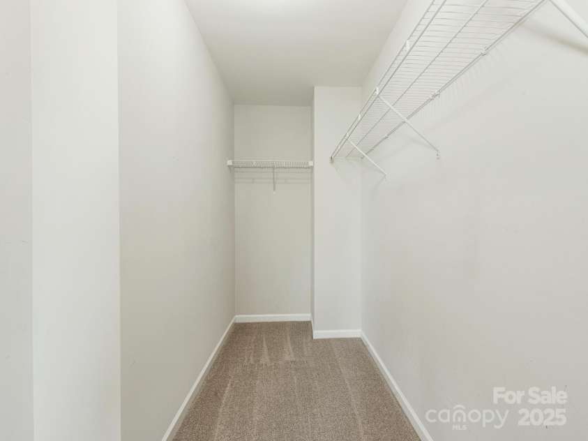 4912 Grace View Drive, Pineville, NC 28134.  MLS# CAR4261040, YatesRealty ID 17367. Large walk-in closet in primary bedroom.