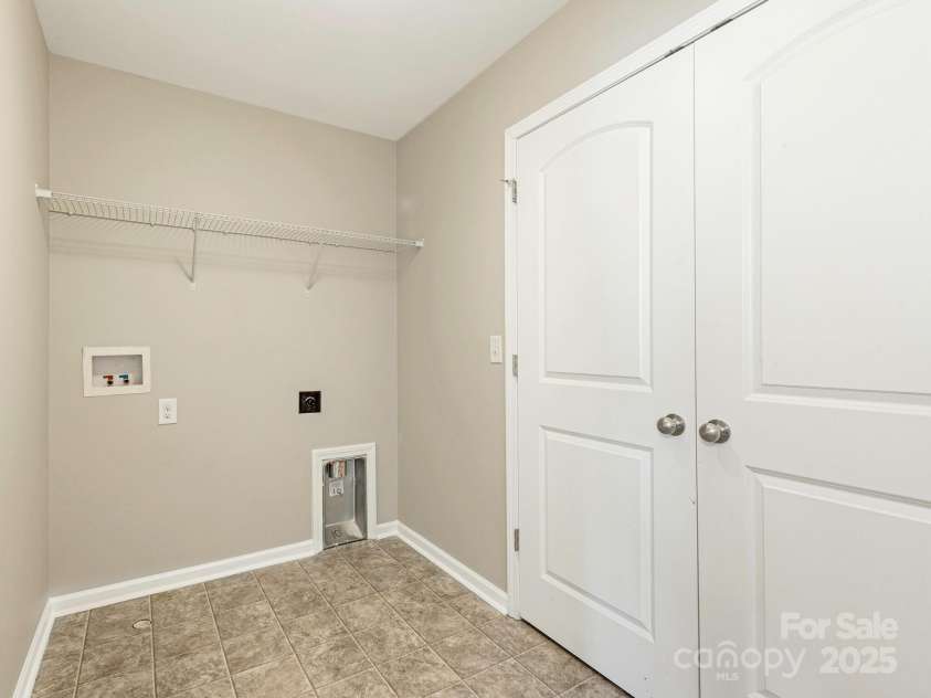 4912 Grace View Drive, Pineville, NC 28134.  MLS# CAR4261040, YatesRealty ID 17367. Upper level laundry room.