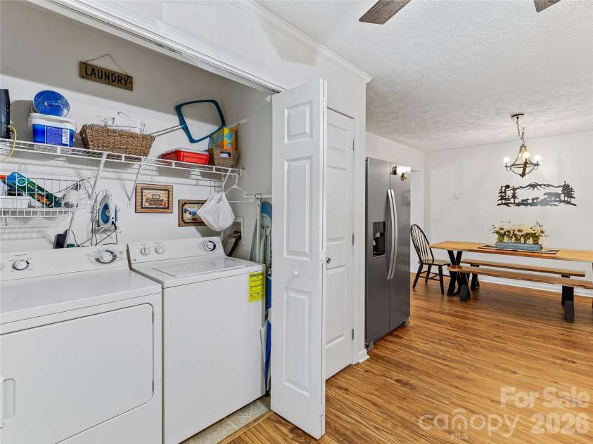 860 Creekside Drive, Maggie Valley, NC 28751.  MLS# CAR4329432, YatesRealty ID 17376. Laundry closet in kitchen