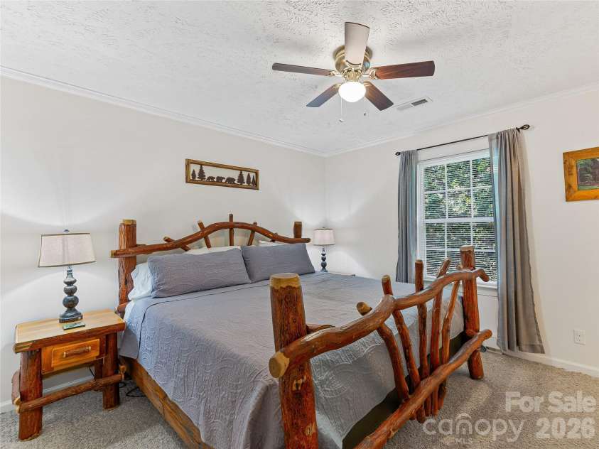 860 Creekside Drive, Maggie Valley, NC 28751.  MLS# CAR4329432, YatesRealty ID 17376. Primary bedroom