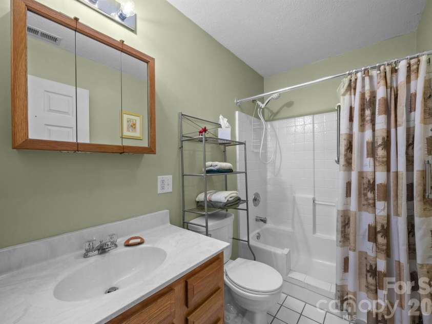 73 Waters Road, Asheville, NC 28805.  MLS# CAR4364687, YatesRealty ID 17378. Full guest bathroom