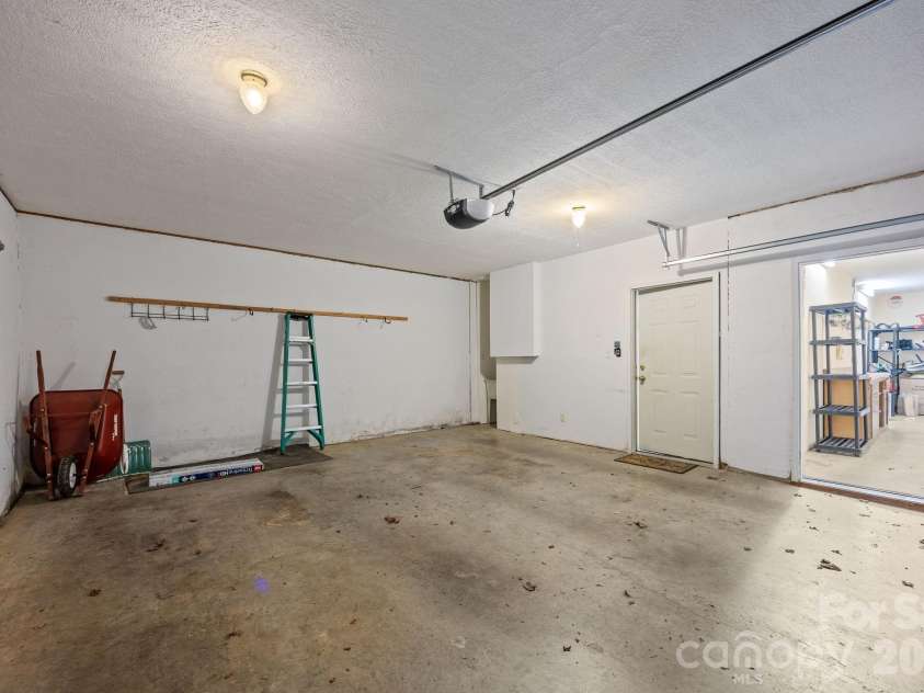 73 Waters Road, Asheville, NC 28805.  MLS# CAR4364687, YatesRealty ID 17378. Large garage with extra storage room