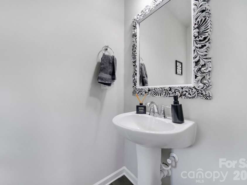 12120 Plover Drive, Charlotte, NC 28269.  MLS# CAR4366477, YatesRealty ID 17383. Half bath when you enter the home