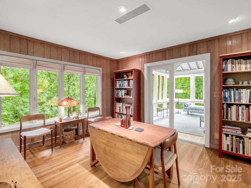 185 Greenstoke Loop, Tryon, NC 28782.  MLS# CAR4261125, YatesRealty ID 17387. Dining area leads to the sunroom