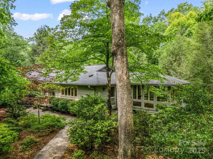 185 Greenstoke Loop, Tryon, NC 28782.  MLS# CAR4261125, YatesRealty ID 17387. Flagstone pathways to the entrance