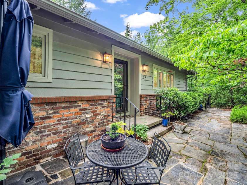 185 Greenstoke Loop, Tryon, NC 28782.  MLS# CAR4261125, YatesRealty ID 17387. Front flagstone patio