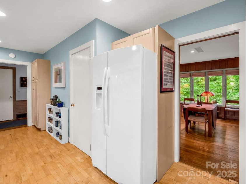 185 Greenstoke Loop, Tryon, NC 28782.  MLS# CAR4261125, YatesRealty ID 17387. Kitchen is on the right as you enter the home and next to the Dining area