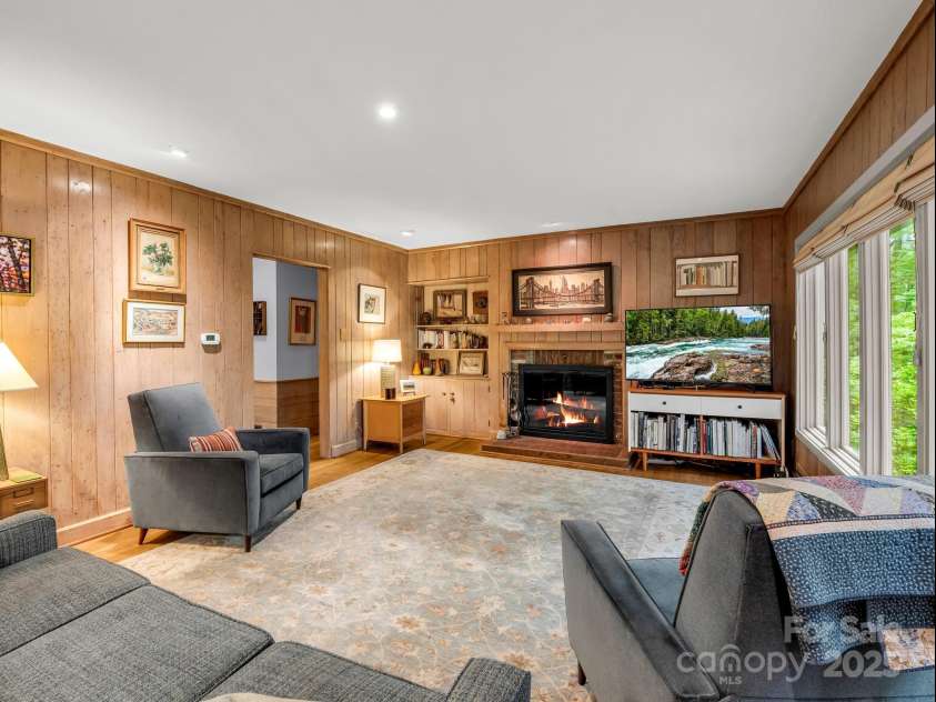 185 Greenstoke Loop, Tryon, NC 28782.  MLS# CAR4261125, YatesRealty ID 17387. Living Room with built-ins