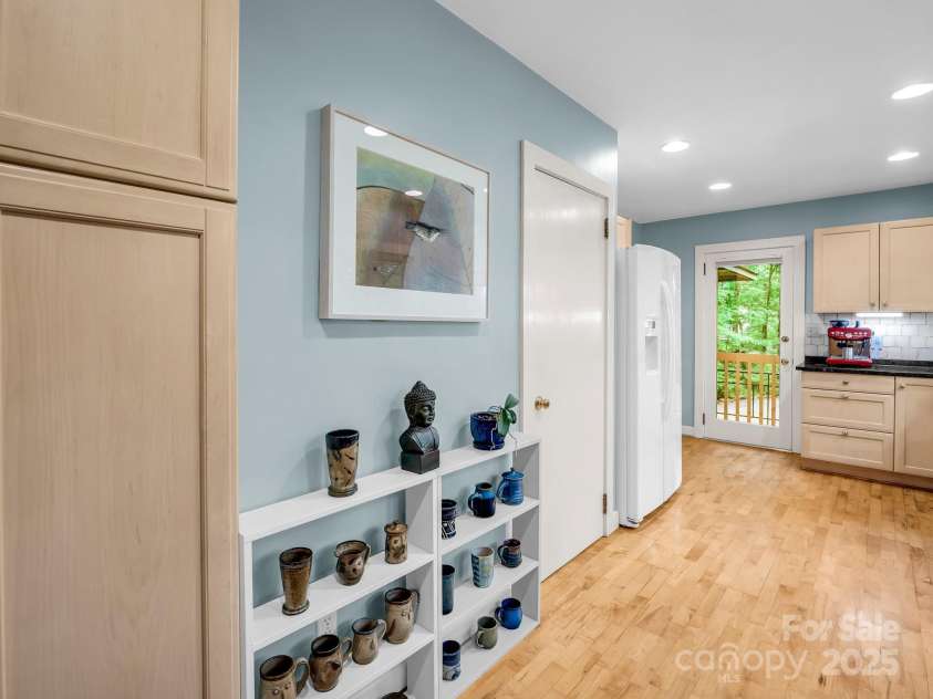 185 Greenstoke Loop, Tryon, NC 28782.  MLS# CAR4261125, YatesRealty ID 17387. Pantry is to the door on the left and also leads to the walk-up attic