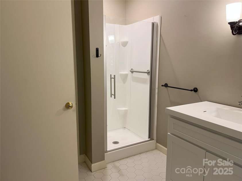 185 Greenstoke Loop, Tryon, NC 28782.  MLS# CAR4261125, YatesRealty ID 17387. Primary bathroom shower