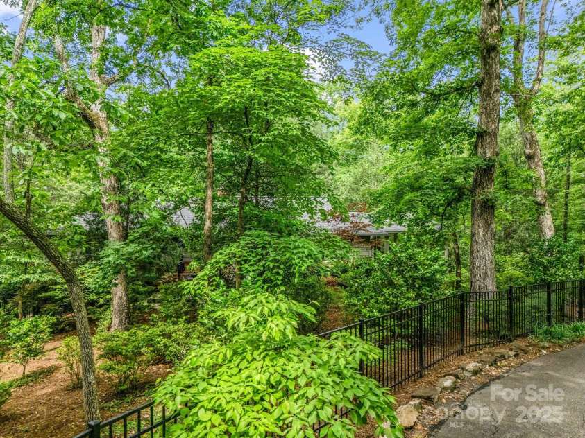 185 Greenstoke Loop, Tryon, NC 28782.  MLS# CAR4261125, YatesRealty ID 17387. Private setting on a quiet street