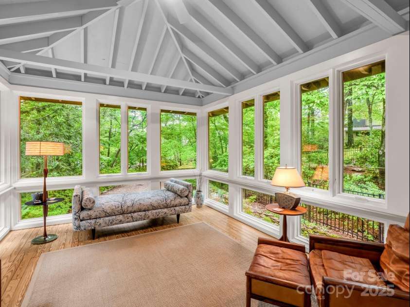 185 Greenstoke Loop, Tryon, NC 28782.  MLS# CAR4261125, YatesRealty ID 17387. Relax in the Sunroom