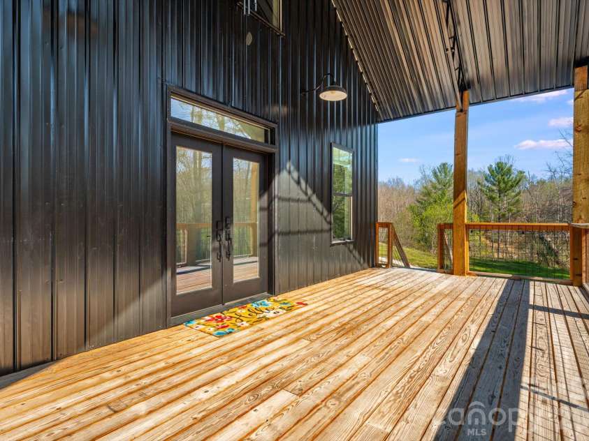 4530 Double Island Road, Green Mountain, NC 28740.  MLS# CAR4362589, YatesRealty ID 17388. Covered back deck entryway