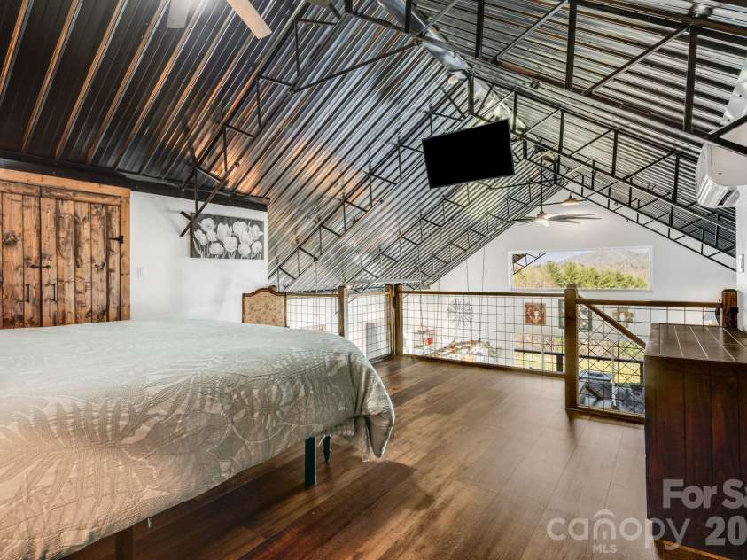 4530 Double Island Road, Green Mountain, NC 28740.  MLS# CAR4362589, YatesRealty ID 17388. Primary bedroom loft