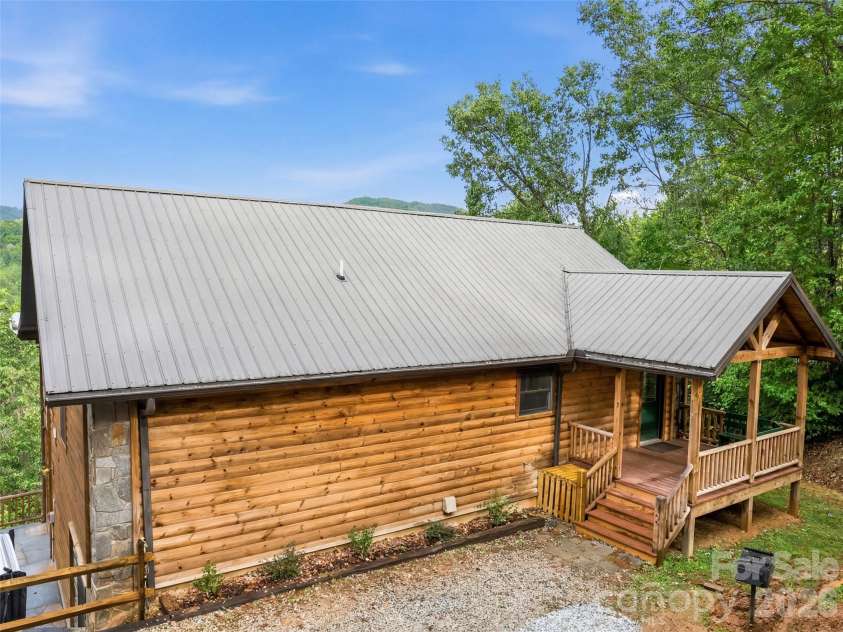235 Soaring Eagle Road, Bryson City, NC 28713.  MLS# CAR4316418, YatesRealty ID 1739. Ample parking and cozy covered entry porch welcome you to the Hawk's View 
