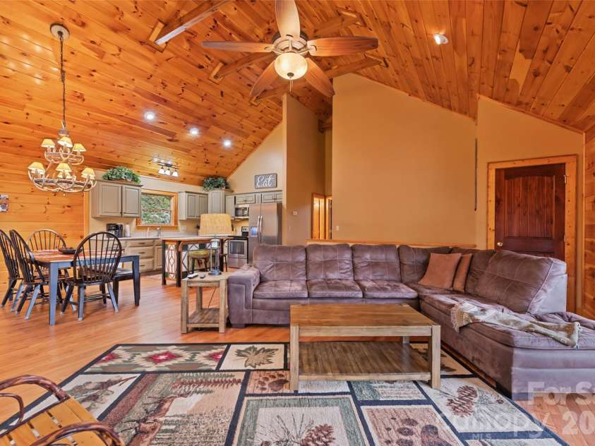 235 Soaring Eagle Road, Bryson City, NC 28713.  MLS# CAR4316418, YatesRealty ID 1739. Great room with living, dining, kitchen and guest bath 