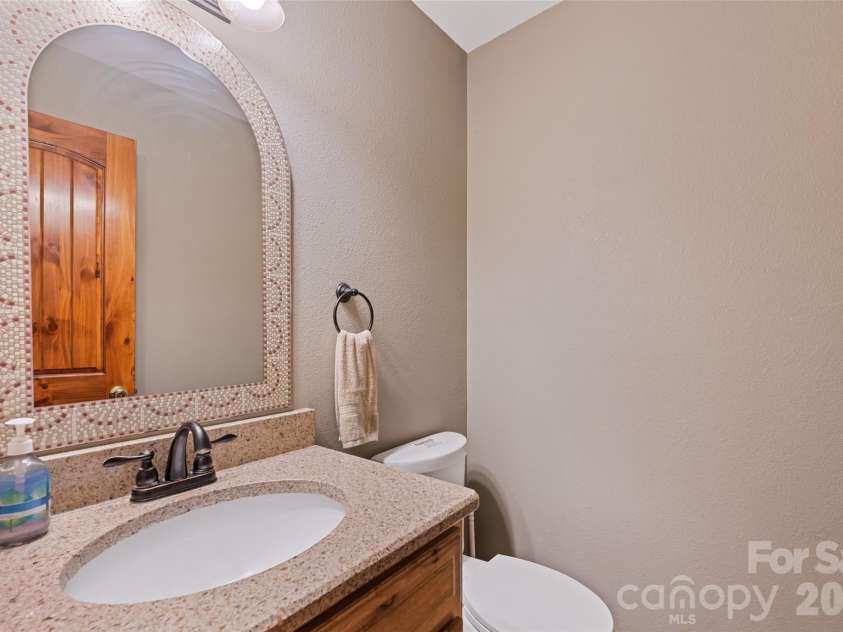 235 Soaring Eagle Road, Bryson City, NC 28713.  MLS# CAR4316418, YatesRealty ID 1739. Half bath on upper floor in great room for convenience 