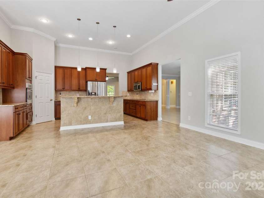 2923 Meadow Creek Lane, Monroe, NC 28110.  MLS# CAR4255594, YatesRealty ID 17394. Looking toward kitchen from fireplace