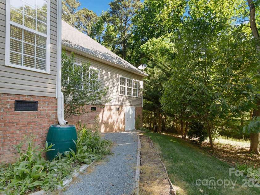 2923 Meadow Creek Lane, Monroe, NC 28110.  MLS# CAR4255594, YatesRealty ID 17394. Pathway to Walk-in Crawlspace