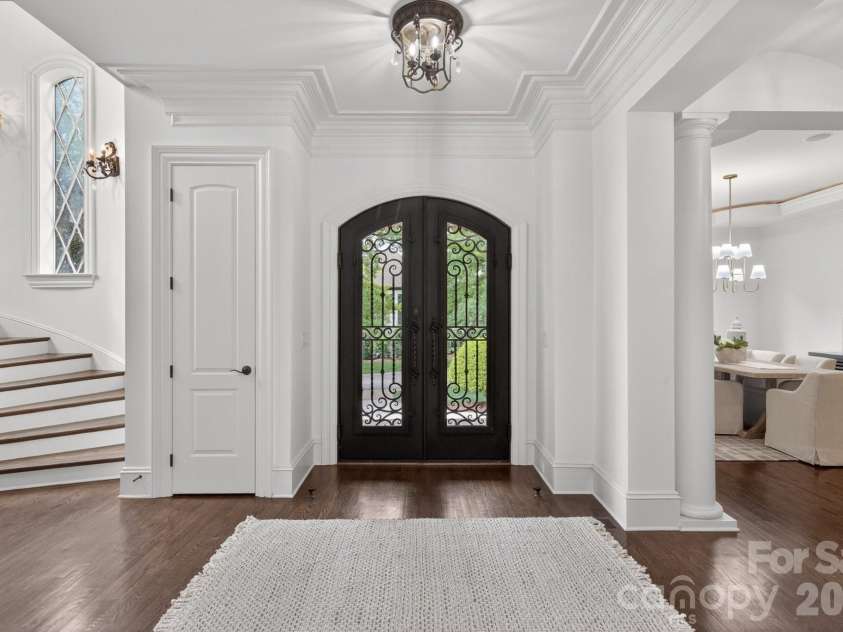 7828 Clovervale Drive, Waxhaw, NC 28173.  MLS# CAR4374597, YatesRealty ID 17395. Custom Iron front door w/natural light
