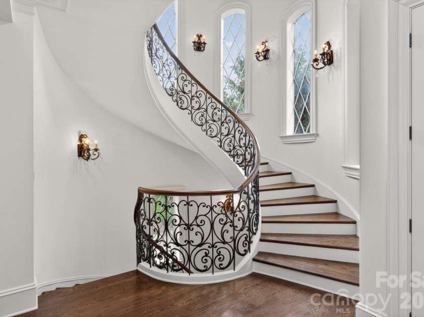 7828 Clovervale Drive, Waxhaw, NC 28173.  MLS# CAR4374597, YatesRealty ID 17395. Custom spiral stairway!