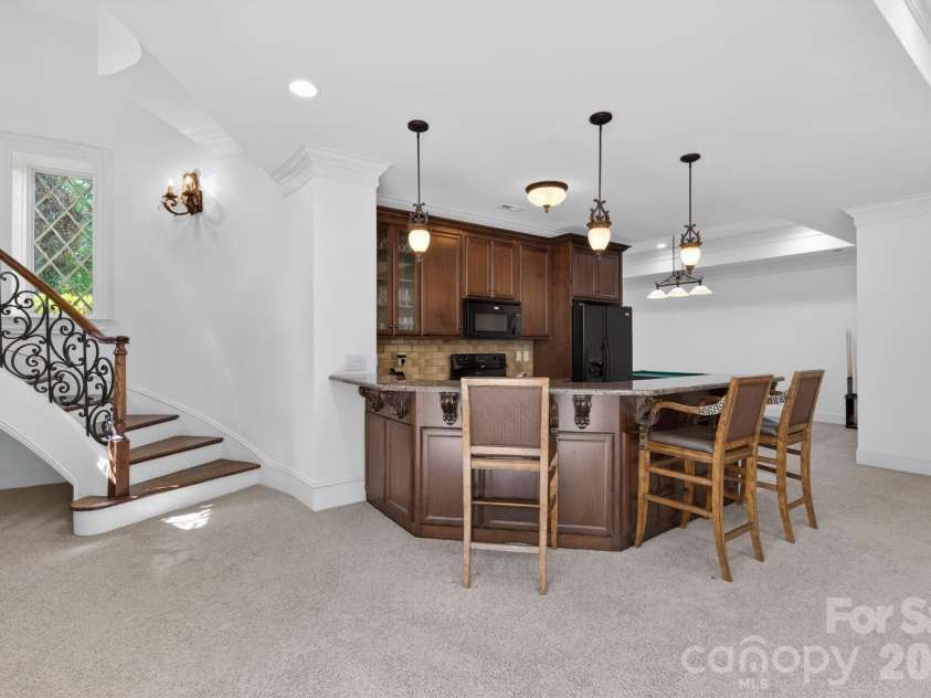 7828 Clovervale Drive, Waxhaw, NC 28173.  MLS# CAR4374597, YatesRealty ID 17395. Lower level w/ kitchen and 1/2 bath