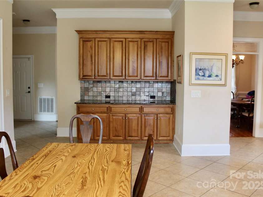 8620 Rolling Fields Road, Charlotte, NC 28227.  MLS# CAR4266446, YatesRealty ID 17398. Additional Buffet Area with extra cabinets and granite countertops.