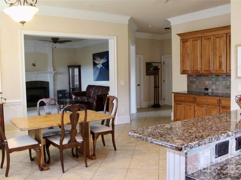 8620 Rolling Fields Road, Charlotte, NC 28227.  MLS# CAR4266446, YatesRealty ID 17398. Looking from Kitchen towards Greatroom