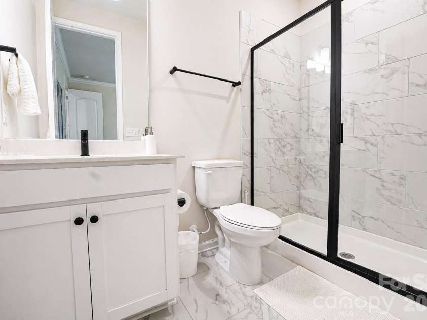 12008 John Newton Drive, Davidson, NC 28036.  MLS# CAR4375341, YatesRealty ID 17400. Lower Guest Bath