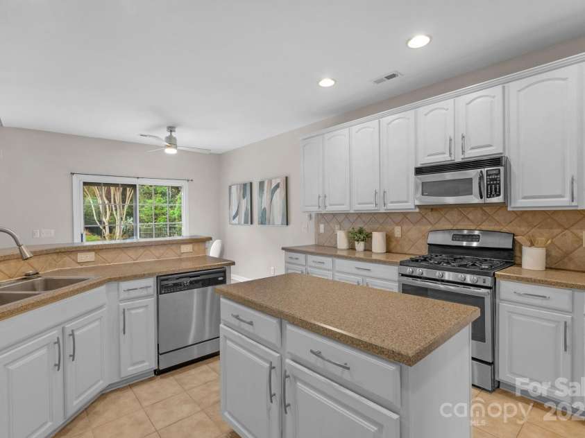 2711 Liberty Hall Court, Waxhaw, NC 28173.  MLS# CAR4228548, YatesRealty ID 17401. Check out all the storage in this kitchen!