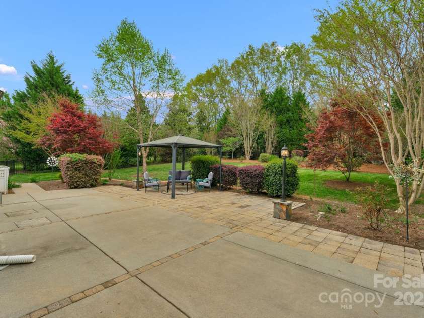 2711 Liberty Hall Court, Waxhaw, NC 28173.  MLS# CAR4228548, YatesRealty ID 17401. Giant patio, pergola and back yard serves as an incredible place to entertain or keep all to yourself as an outdoor oasis.