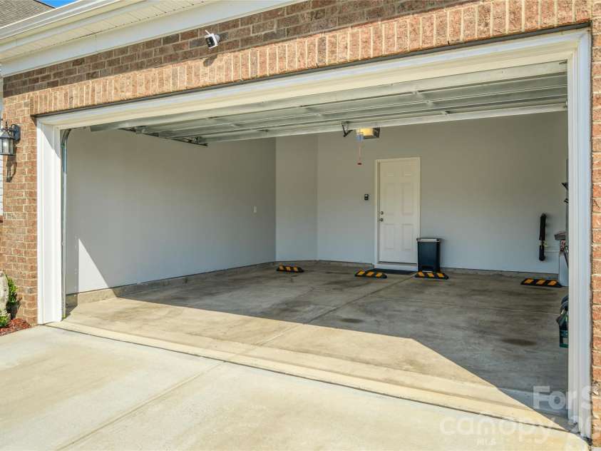 3881 Center Place Drive, Harrisburg, NC 28075.  MLS# CAR4372503, YatesRealty ID 17403. Fully finished garage