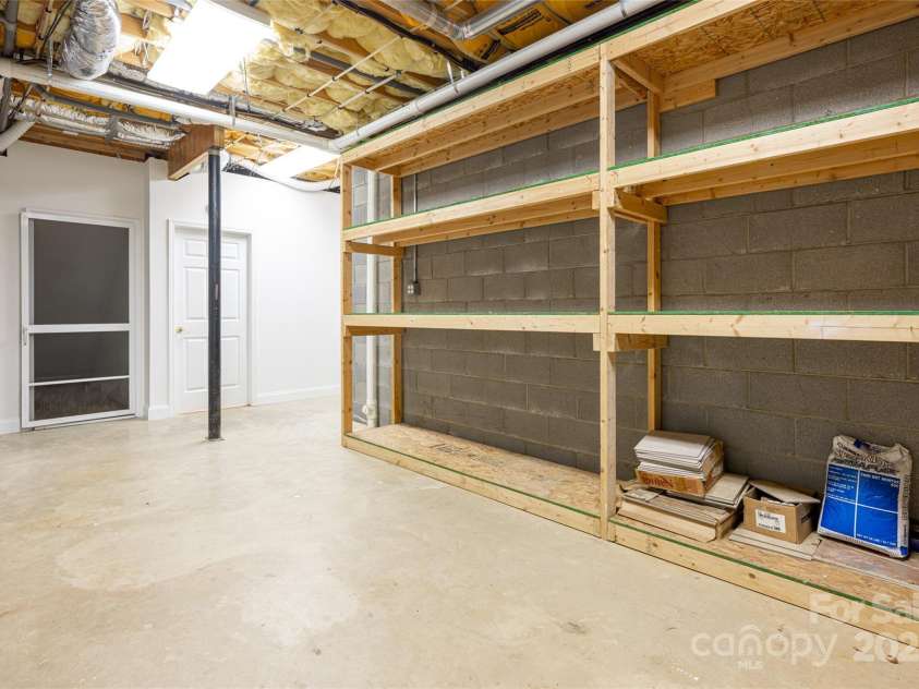 8 Scarlet Rdg Lane, Weaverville, NC 28787.  MLS# CAR4233209, YatesRealty ID 17414. Ample dry storage with shelving