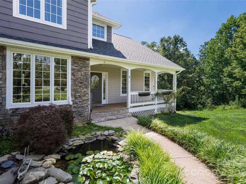 8 Scarlet Rdg Lane, Weaverville, NC 28787.  MLS# CAR4233209, YatesRealty ID 17414. Gracious entry with Koi pond