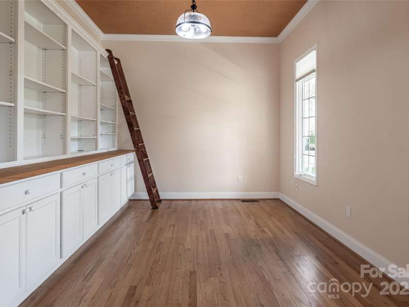8 Scarlet Rdg Lane, Weaverville, NC 28787.  MLS# CAR4233209, YatesRealty ID 17414. Home office with built-ins and quaint library ladder