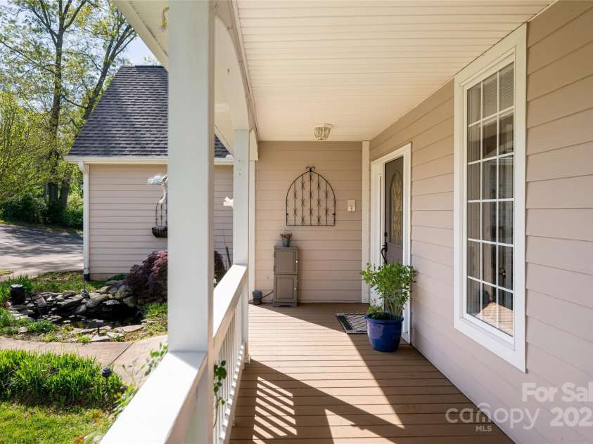8 Scarlet Rdg Lane, Weaverville, NC 28787.  MLS# CAR4233209, YatesRealty ID 17414. Rocking chair front porch