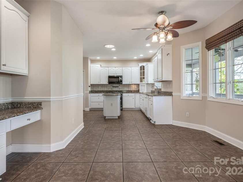 8 Scarlet Rdg Lane, Weaverville, NC 28787.  MLS# CAR4233209, YatesRealty ID 17414. Spacious kitchen with island and breakfast nook