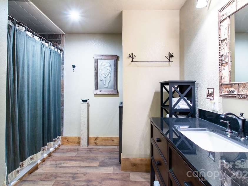 58 Great Aspen Way, Black Mountain, NC 28711.  MLS# CAR4256095, YatesRealty ID 17415. A look at the downstairs apartment bathroom. Note the lovely bathroom vanity countertop.