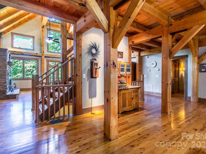 58 Great Aspen Way, Black Mountain, NC 28711.  MLS# CAR4256095, YatesRealty ID 17415. Angle from the kitchen looking into the living room. You can put a formal china cabinet on the wall near the stairs facing the kitchen.