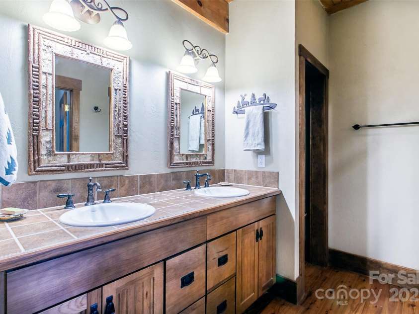 58 Great Aspen Way, Black Mountain, NC 28711.  MLS# CAR4256095, YatesRealty ID 17415. Another look at the twin vanities in the primary bathroom.