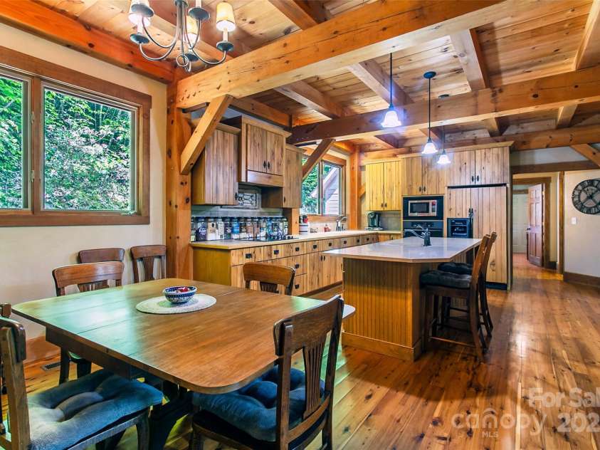 58 Great Aspen Way, Black Mountain, NC 28711.  MLS# CAR4256095, YatesRealty ID 17415. Another look at this beautiful kitchen that features a Zodiac quartz-topped island. That countertop is heat resistant to 500 degrees Fahrenheit and will not scratch.