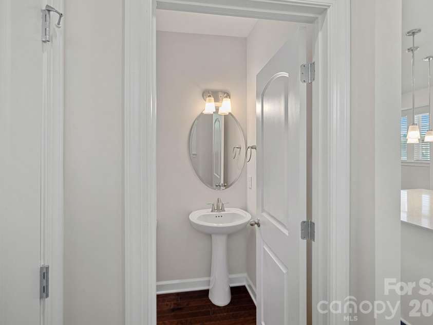 11523 Red Rust Lane, Charlotte, NC 28277.  MLS# CAR4376500, YatesRealty ID 17420. Convenient pantry and half-bath just off the kitchen.