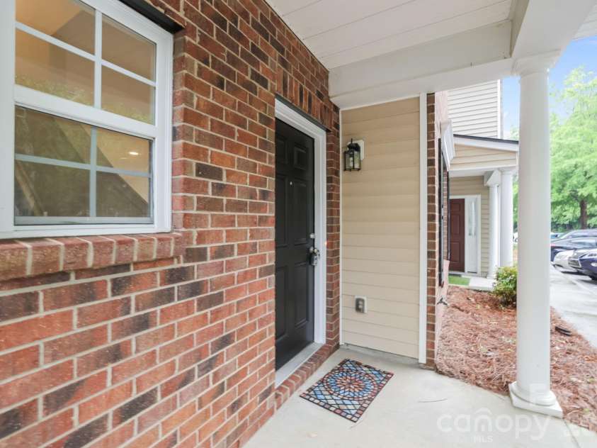 8738 Twined Creek Lane, Charlotte, NC 28227.  MLS# CAR4376717, YatesRealty ID 17423. Covered porch area ready for your favorite decorations and plants. 
