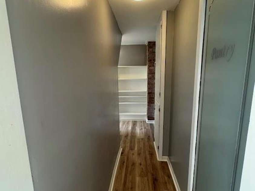 1019 Valley Street, Kannapolis, NC 28081.  MLS# CAR4251988, YatesRealty ID 17425. Pantry door and hall that leads to laundry and water heater