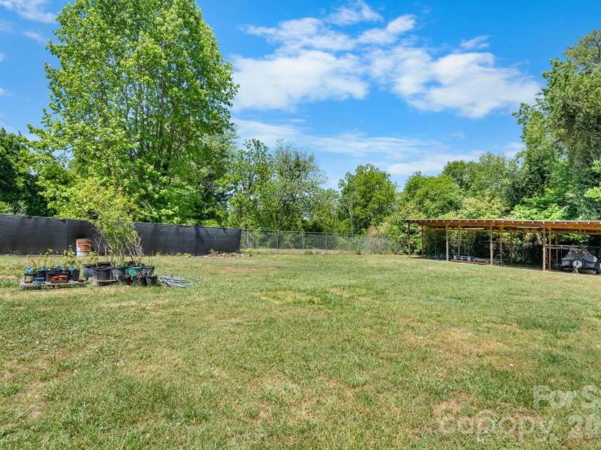3706 2nd Avenue, Hickory, NC 28601.  MLS# CAR4374944, YatesRealty ID 17428. Back Yard left corner