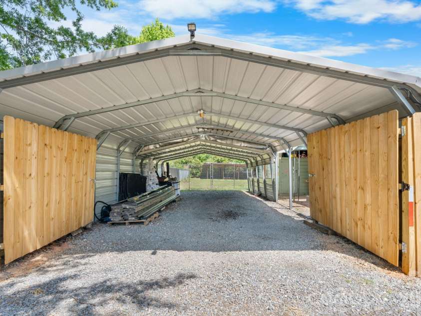 3706 2nd Avenue, Hickory, NC 28601.  MLS# CAR4374944, YatesRealty ID 17428. Carport looking to back yard