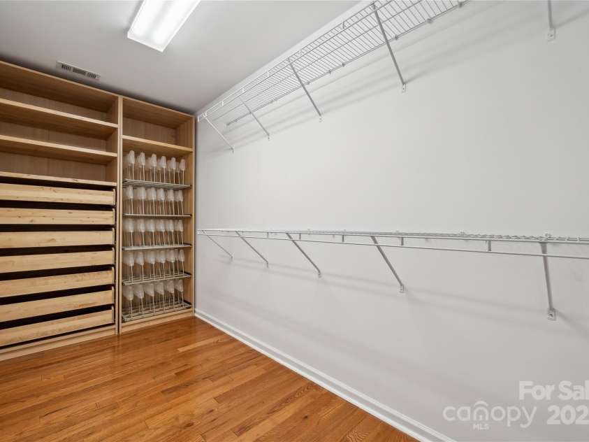 5046 Cressingham Drive, Fort Mill, SC 29707.  MLS# CAR4263729, YatesRealty ID 17429. Custom primary closet- check out the shoe caddies