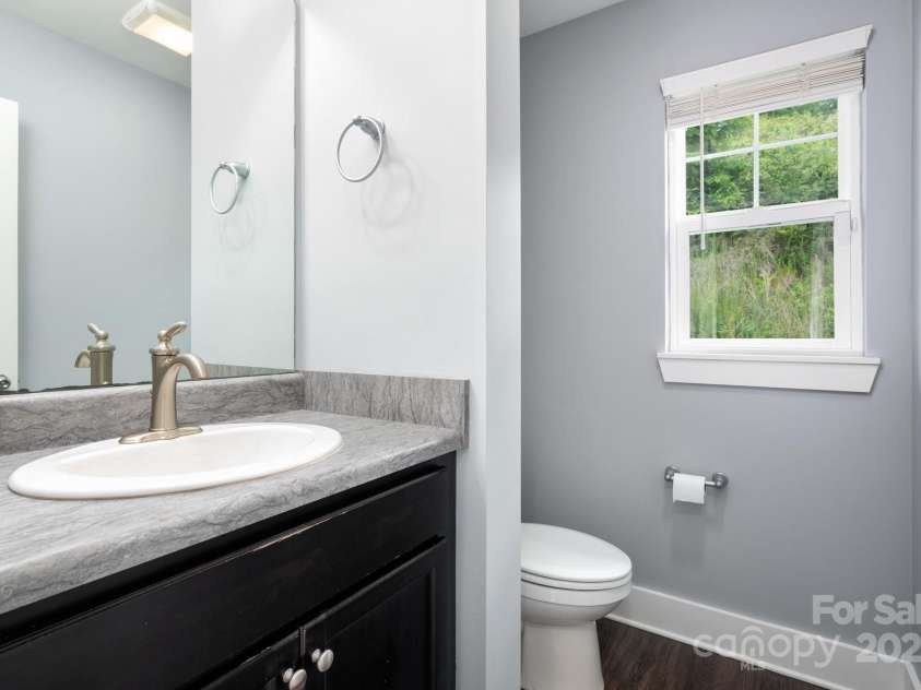 207 Stoney Point Way, Candler, NC 28715.  MLS# CAR4260849, YatesRealty ID 17441. Convenient Main-Level Powder Room