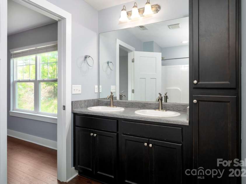 207 Stoney Point Way, Candler, NC 28715.  MLS# CAR4260849, YatesRealty ID 17441. Dual Sinks in the Primary Bathroom
