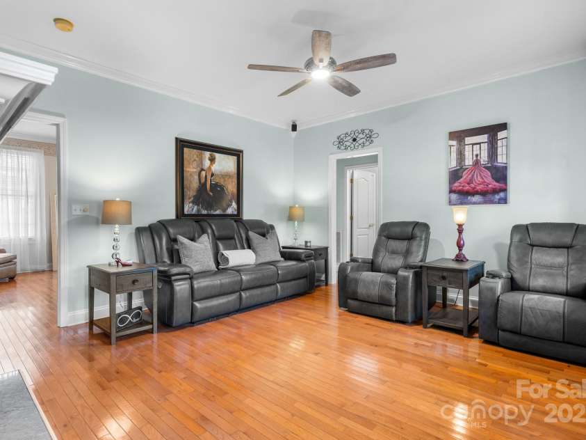 1246 Hillsboro Avenue, Hickory, NC 28602.  MLS# CAR4199854, YatesRealty ID 1745. Living room with Hardwood flooring, molding, see through fireplace.